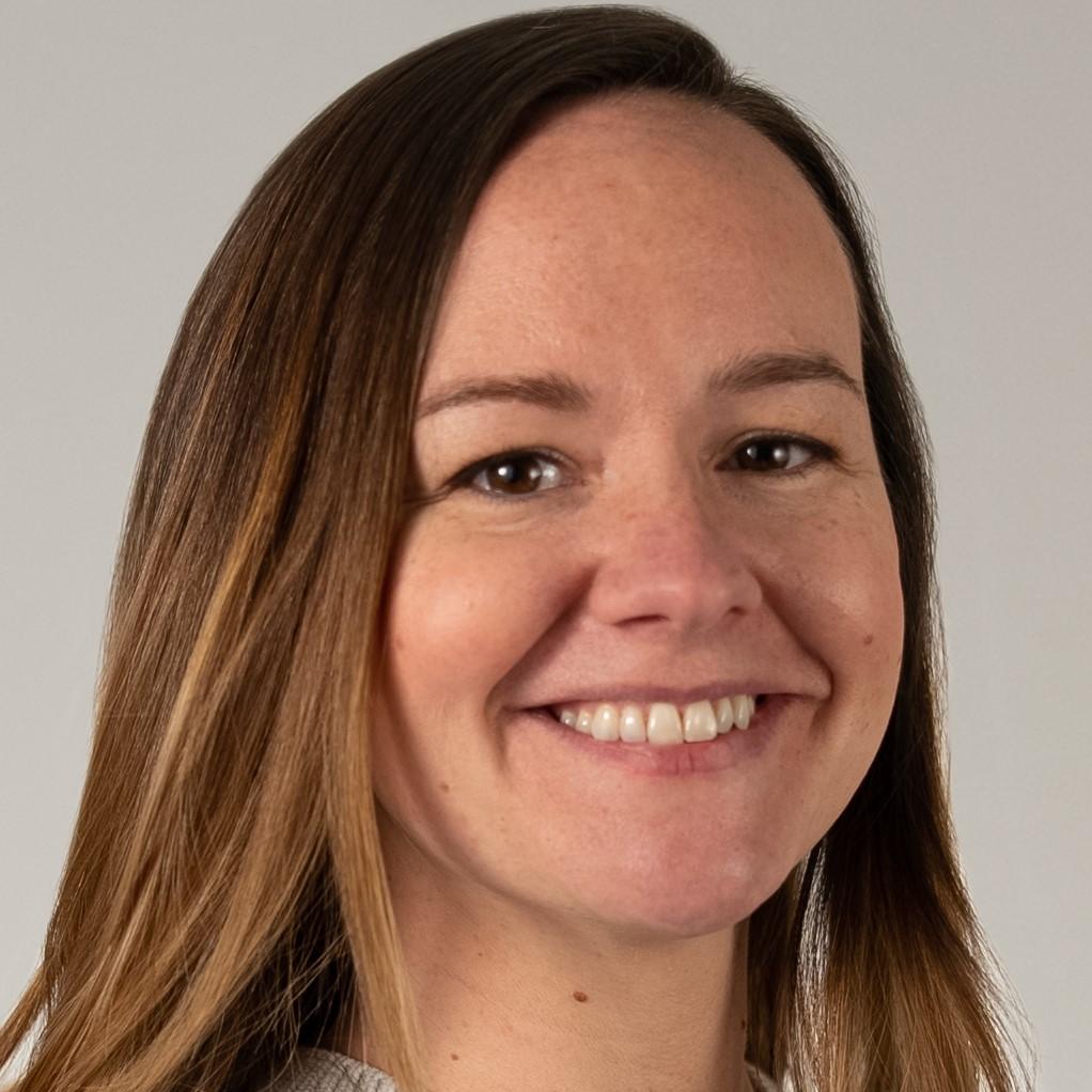 Katie Reynolds headshot: female with long brown hair